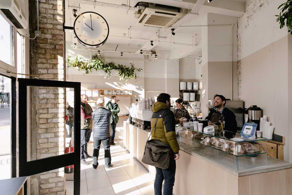 Interior of Rosslyn Coffee's Queen Victoria Street branch in the City of London, showing the counter and seating area